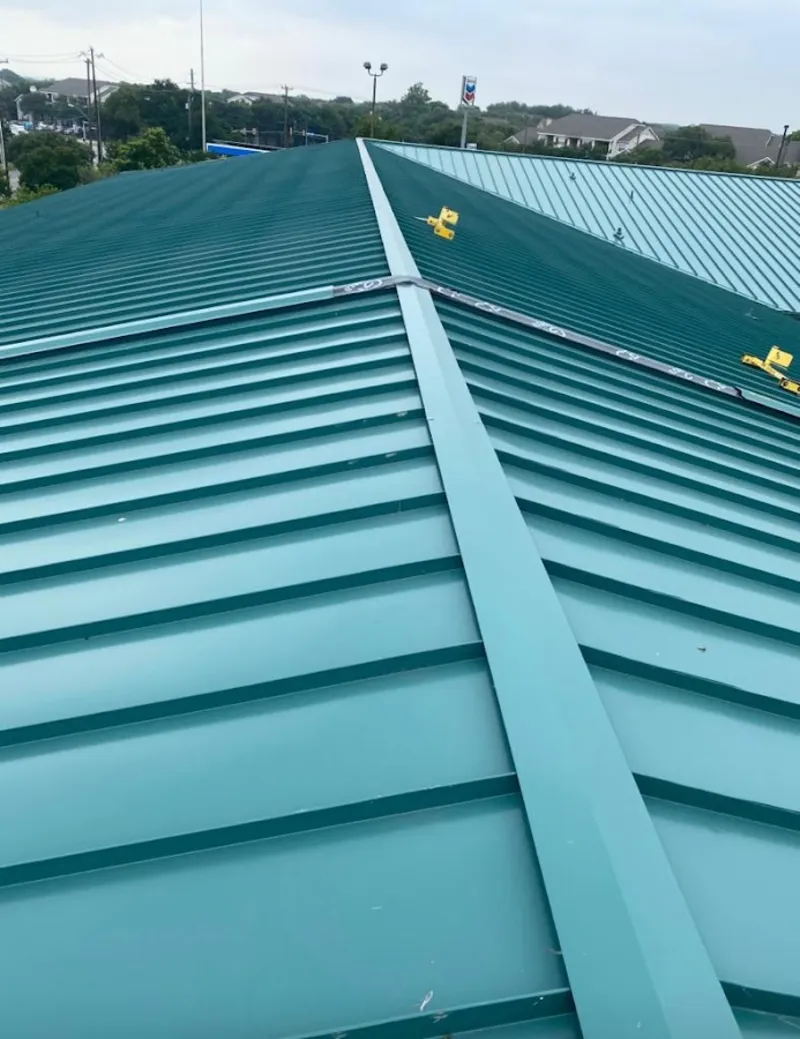 Green commercial metal roof ridge and valley for Metal Roof Repair in Dickinson